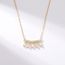 Gouden collier met hangende baguette stenen