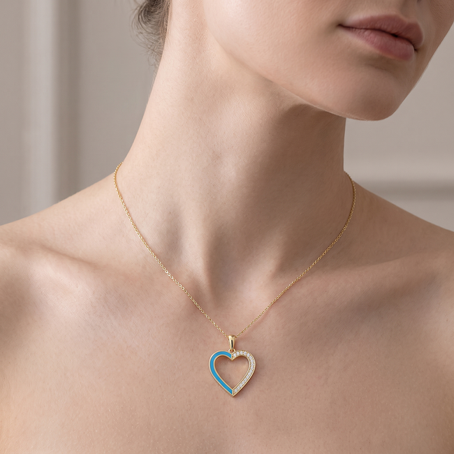 Gouden collier met open hartdesign en stenenrand