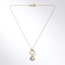 Gouden collier open hart met paarse steen