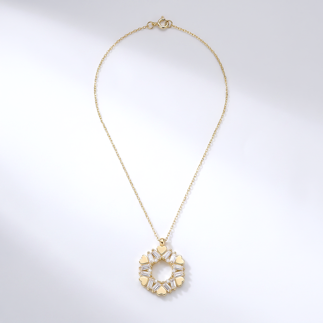 Gouden collier met hartjes en baguette zirkonia
