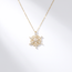 Gouden collier sneeuwvlok met hartjes