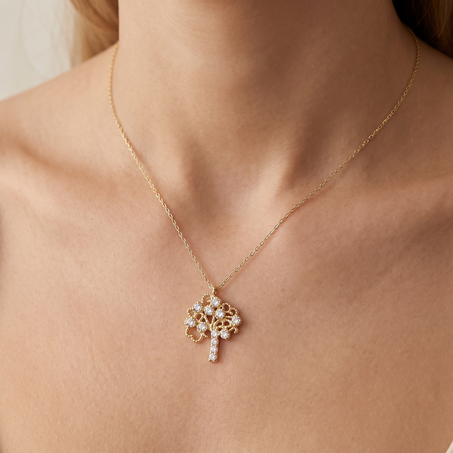 Betekenisvol gouden collier met levensboom hanger