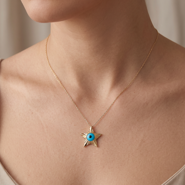 Gouden sterhanger met turquoise nazar oog
