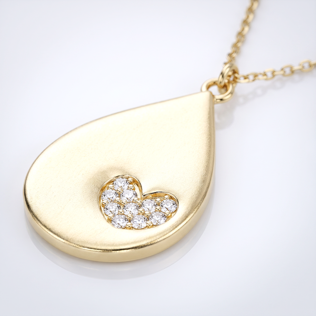 Gouden collier met druppelhanger en hartje