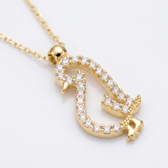Gouden collier met pinguïn hanger