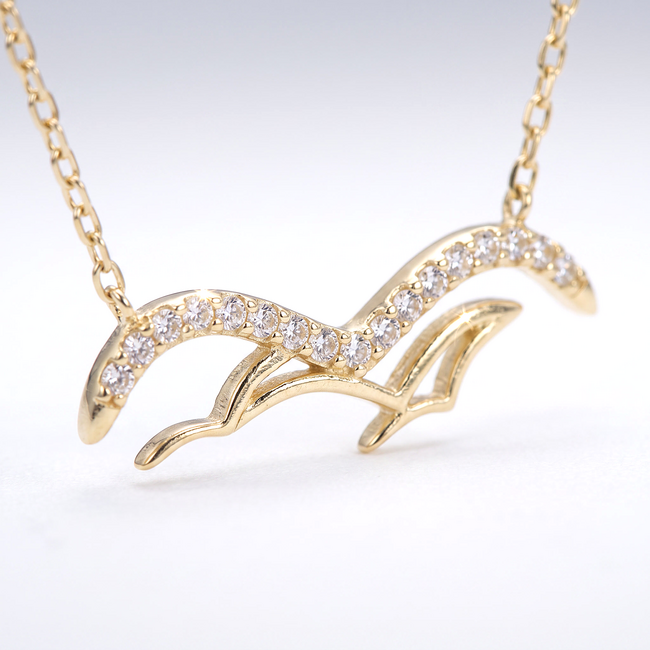 Gouden collier met dolfijnvorm en zirkonia