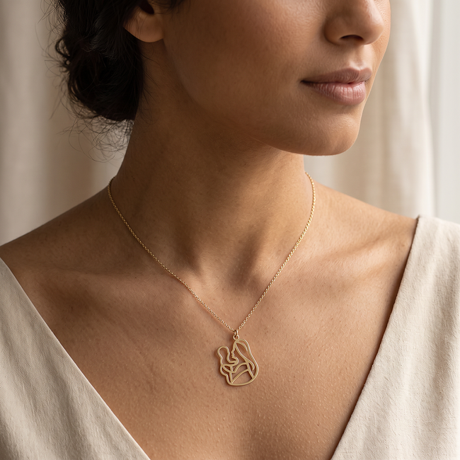 Gouden collier met moeder en kind hanger