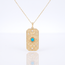 Gouden collier met turquoise steen en oogmotief