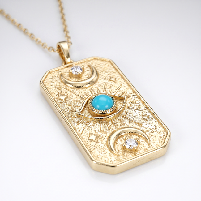 Gouden collier met turquoise steen en oogmotief