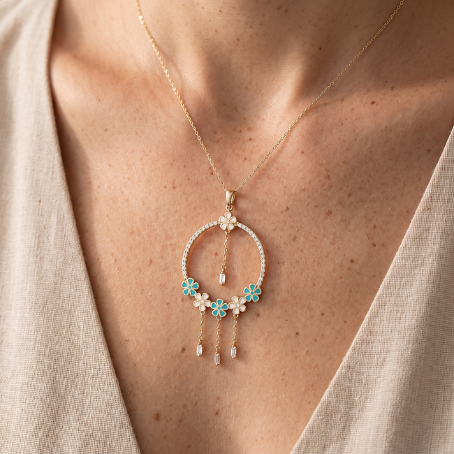Gouden collier met turquoise bloemen en zirkonia