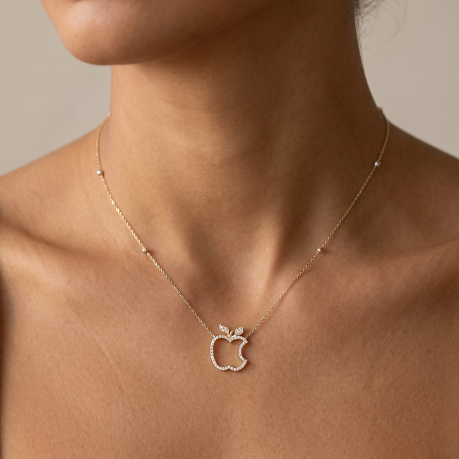 Gouden collier met appelhanger en zirkonia