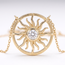 Gouden ketting met zonvormige hanger en steen