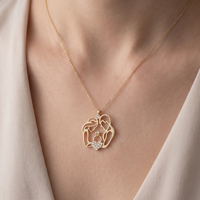 Gouden familie ketting met ouders en kind