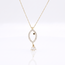 Gouden collier met visvormige hanger en details