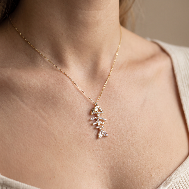 Gouden collier met visgraat hanger