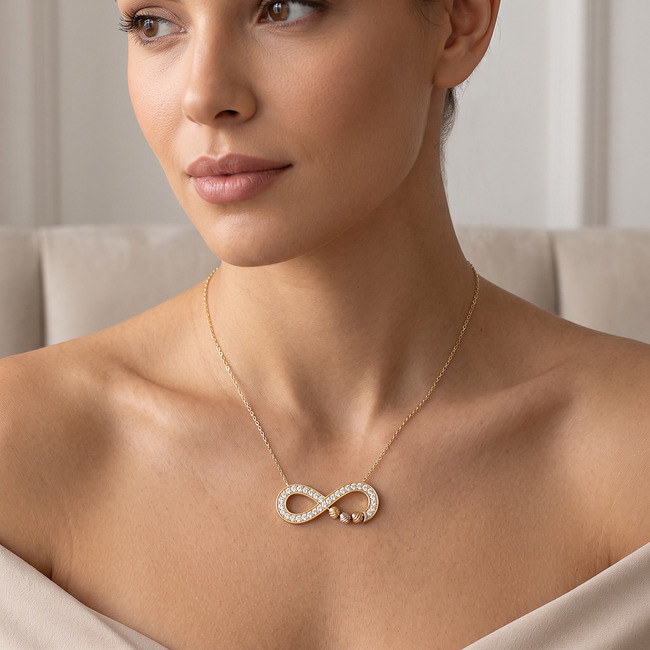 14 karaat gouden infinity collier met dorika