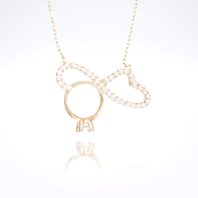 Gouden infinity hart collier met ringdetail