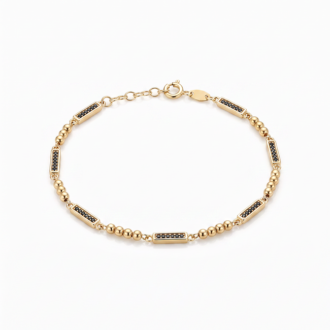 Gouden bolletjesarmband zwarte zirkonia