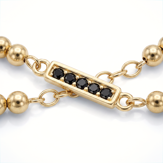 Gouden bolletjesarmband zwarte zirkonia
