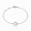 Witgouden armband met open ster en pavé diamanten