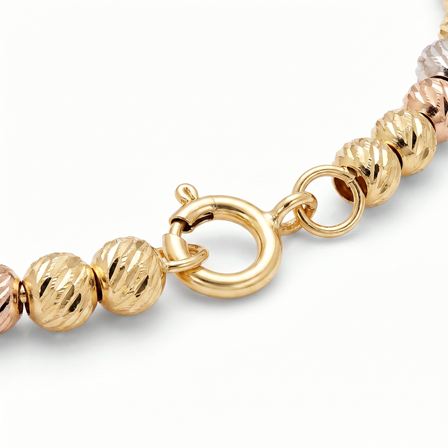Gouden dorika armband 14 karaat tricolor met geslepen bolletjes