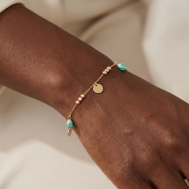 Gouden armband 14 karaat met muntjes