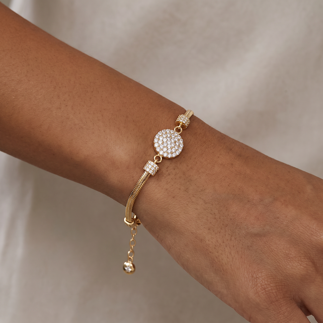 Gouden slangenarmband 14 karaat met rond middenstuk vol zirkonia