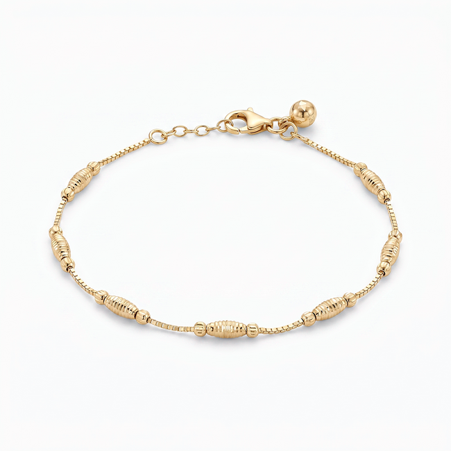 Gouden kralen armband 14 karaat met langwerpige dorika kralen