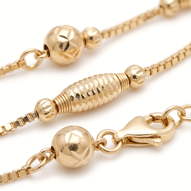 Gouden kralen armband 14 karaat met langwerpige dorika kralen