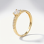 Gouden ring 14 karaat met ronde zirkonia en pavé gezette band