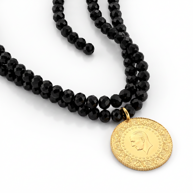 Zwarte kralenketting met siergouden accenten