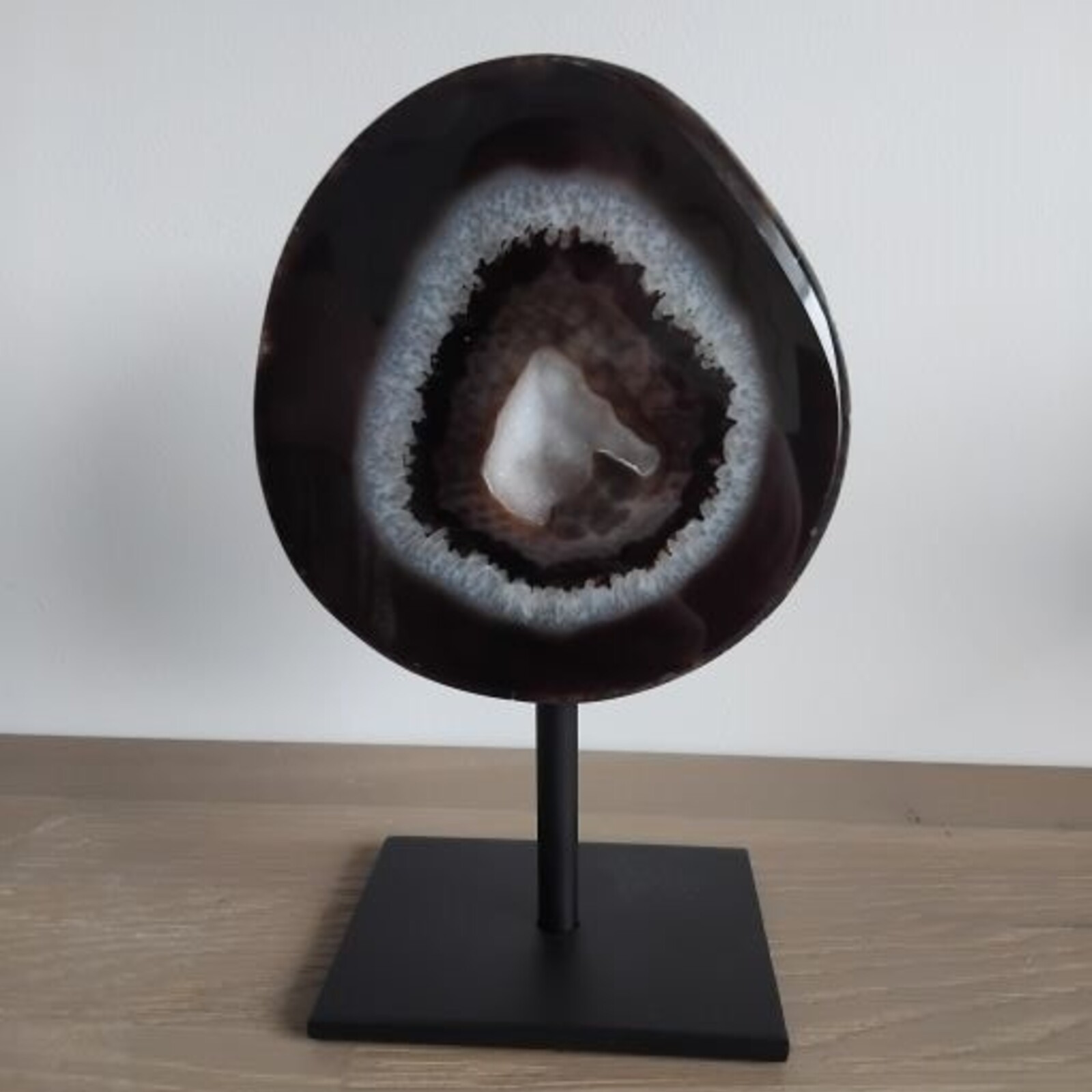 Agate with rock crystal geode on stand