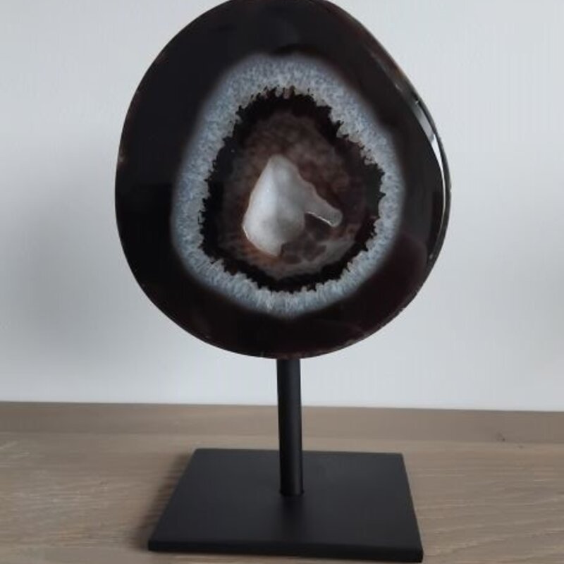 Agate with rock crystal geode on stand