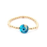 Lucky eye round blue patch gold coloured Lucky eye round blue patch gold coloured