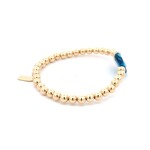 Lucky eye round blue patch gold coloured Lucky eye round blue patch gold coloured