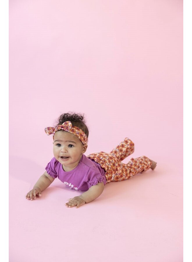 Flare broek AOP - Love Peace Aloha | Perzik