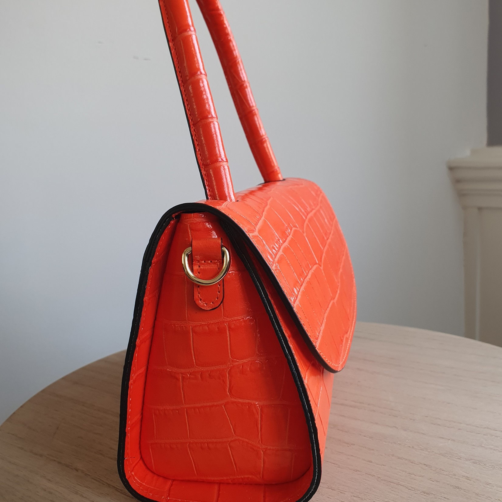 FIRST LADY FIRENZE Orangefarbene Ledertasche mit Aufdruck