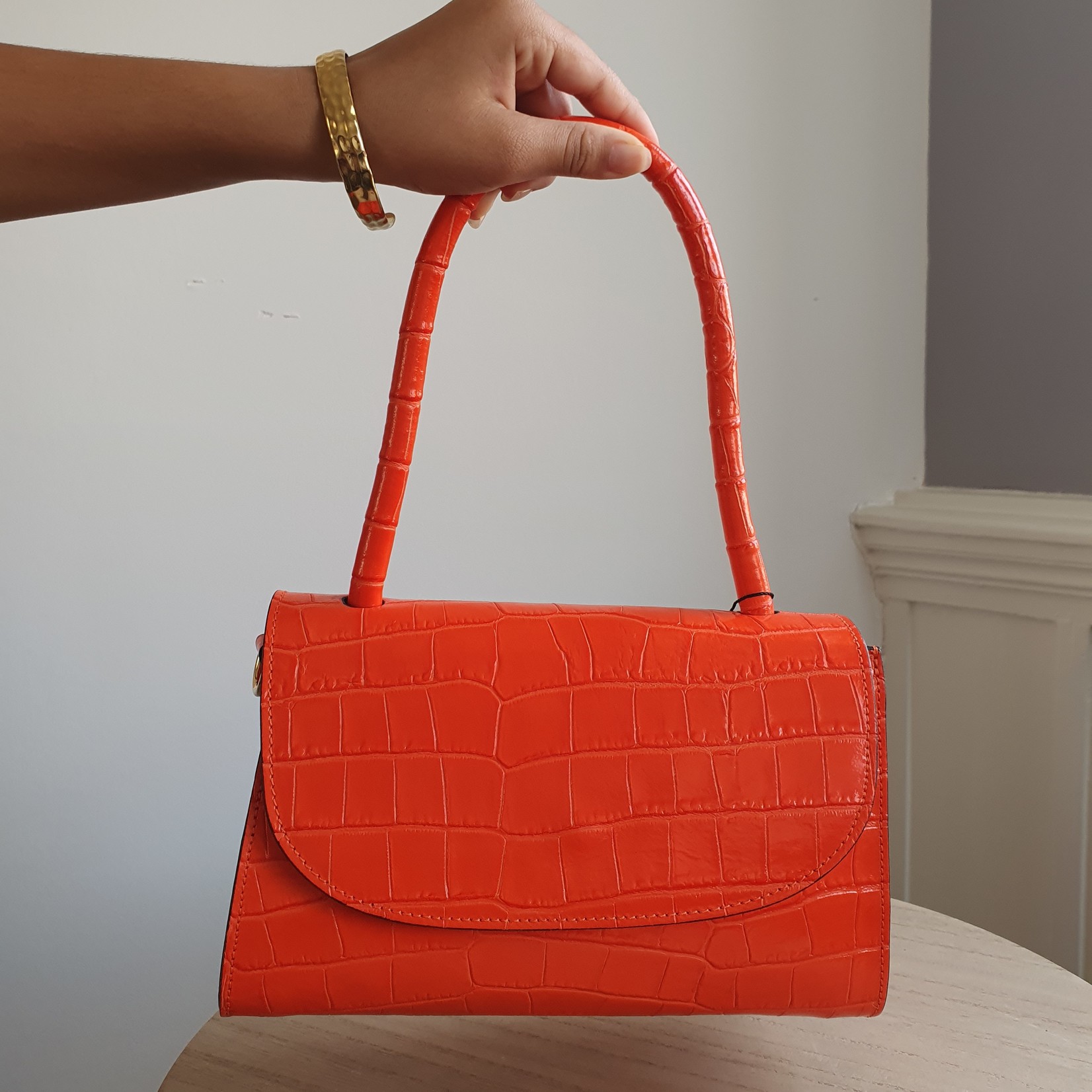 FIRST LADY FIRENZE Orangefarbene Ledertasche mit Aufdruck