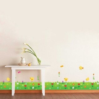 Muursticker kinderkamer gras strook met bloemen en kuikens