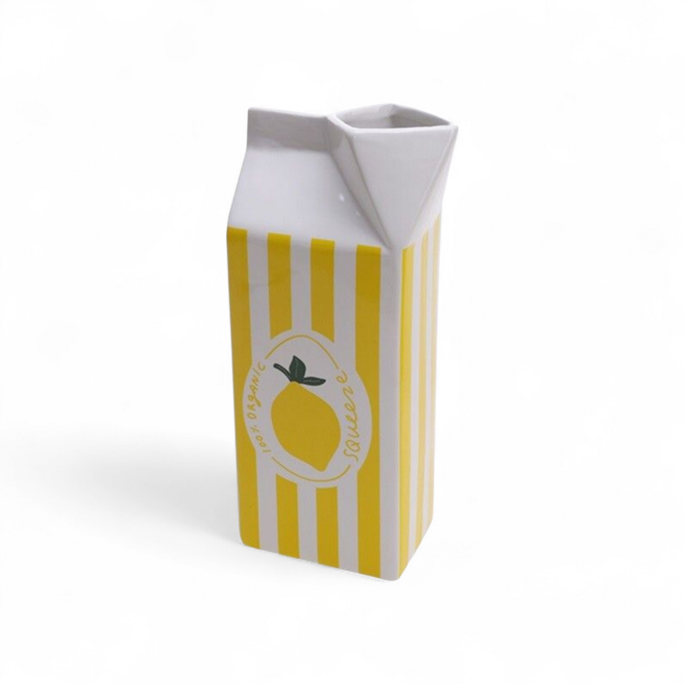 Earthenware lemon juice carton vase
