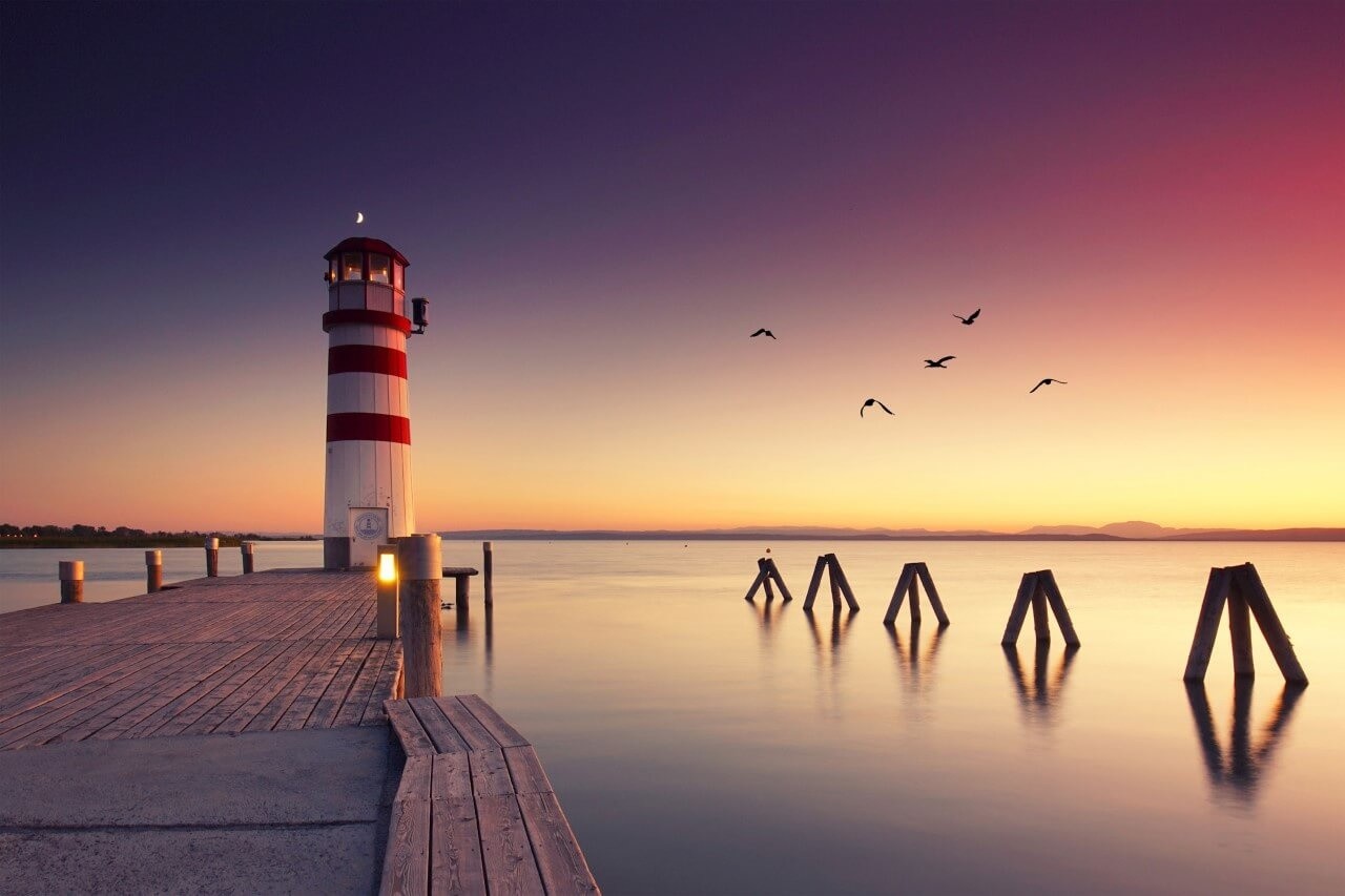 Schilderij Zonsondergang bij de vuurtoren | 90 x 60 cm glasschilderij Schilderij Zonsondergang bij de vuurtoren | 90 x 60 cm glasschilderij