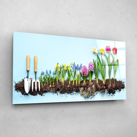 Schilderij Panorama lentebloeiers op een bedje van zand | 60 x 30 cm glasschilderij Schilderij Panorama lentebloeiers op een bedje van zand | 60 x 30 cm glasschilderij