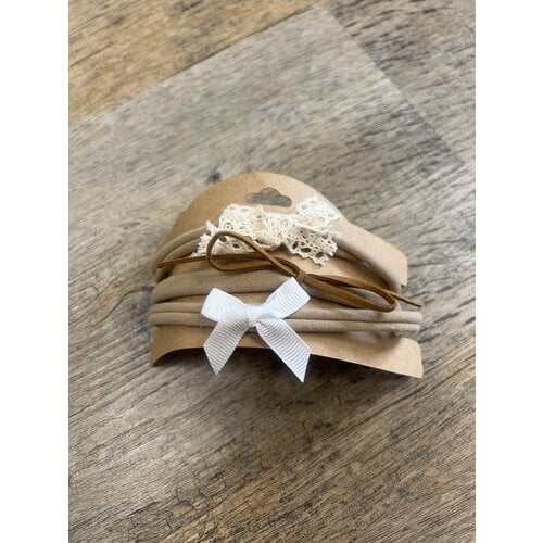 Toutesorte set van 3 haarbandjes cognac/creme/wit €3 Toutesorte set van 3 haarbandjes cognac/creme/wit €3