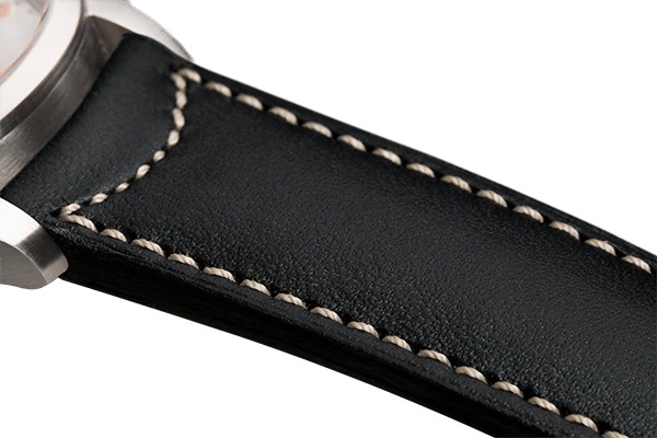 Bracelet plein en cuir noir surpiqué écru