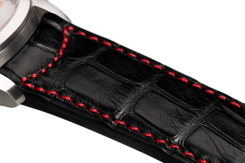 Bracelet plein en alligator noir surpiqué rouge