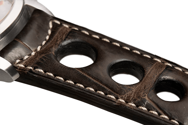 Bracelet aéré en alligator brun foncé surpiqué écru