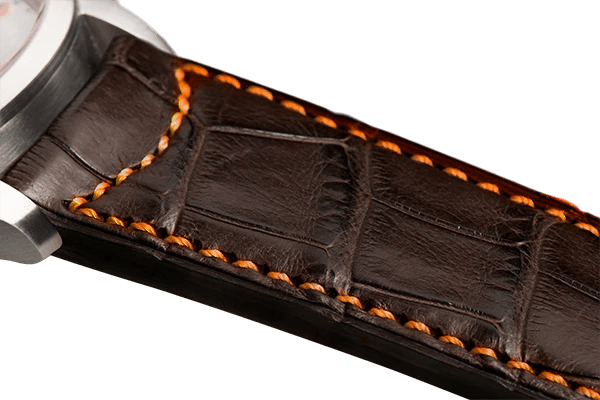 Bracelet plein en alligator brun foncé surpiqué orange