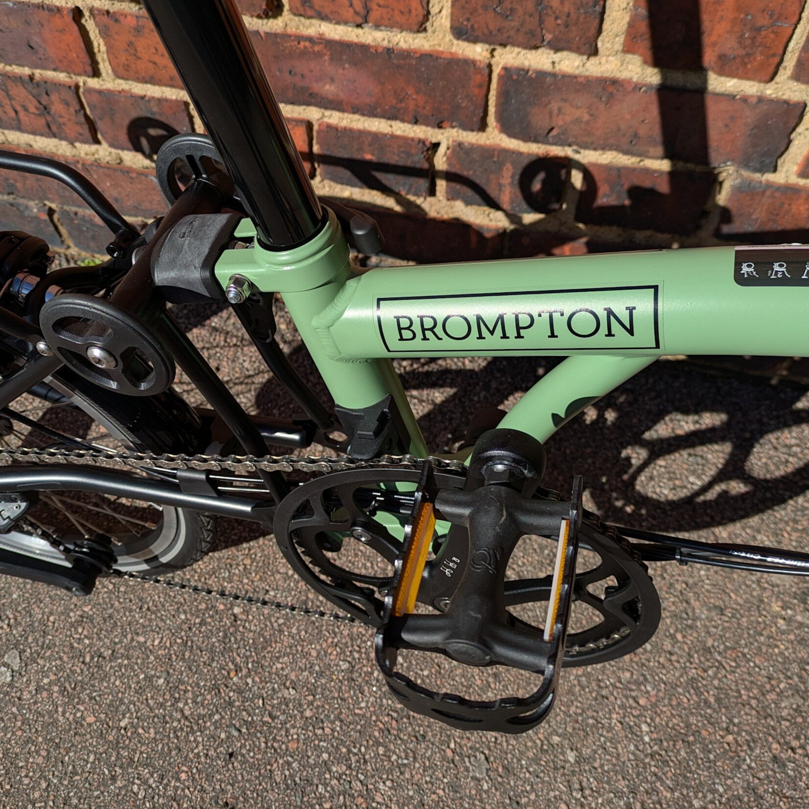 Brompton EX-DEMO Electric C Line 4 Speed Mid Folding Bike with Roller Rack - Matcha Green and Black
