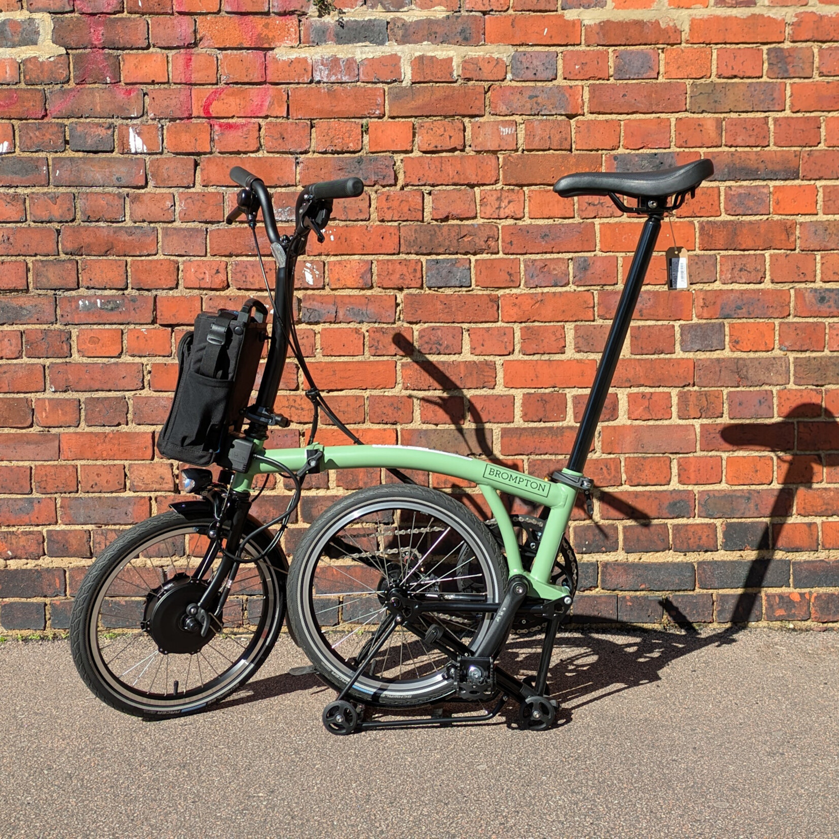 Brompton EX-DEMO Electric C Line 4 Speed Mid Folding Bike with Roller Rack - Matcha Green and Black