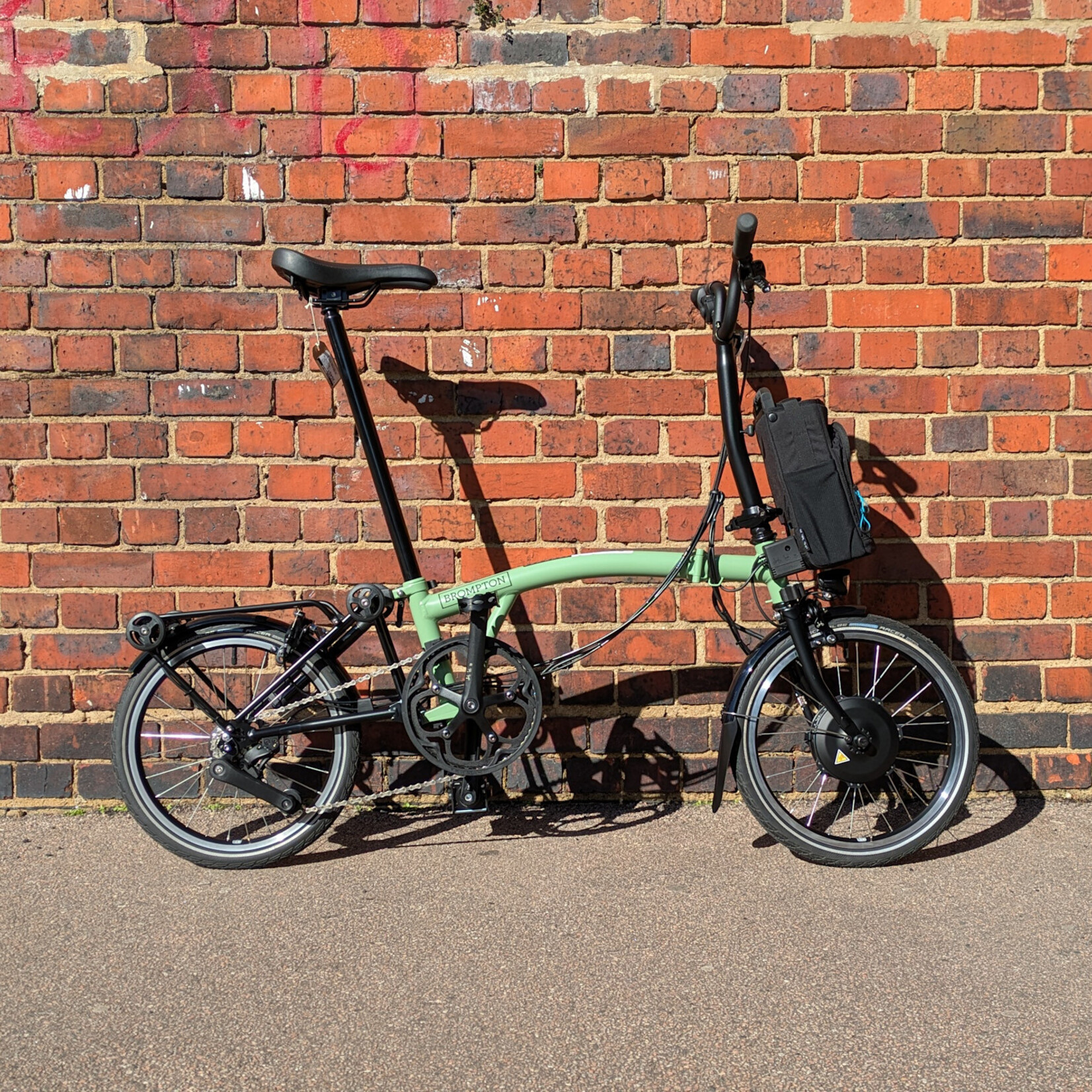 Brompton EX-DEMO Electric C Line 4 Speed Mid Folding Bike with Roller Rack - Matcha Green and Black